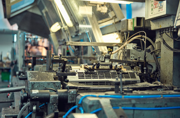  A toilet paper making machine, producing toilet and bathroom paper rolls due to Corona virus panic buying.  Paper and tissue manufacturers factory and engineered machinery.