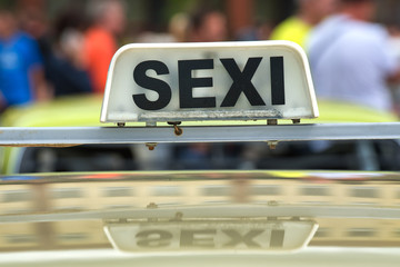 converted taxi sign on the street
