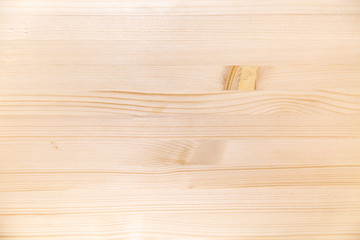 Background of plank pine light brown color with a beautiful pattern of the structure of trees knots. Design backgrounds textures construction.