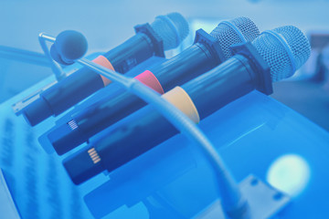 Wireless microphones on the table. Close up of microphones in conference room. Closeup at business...