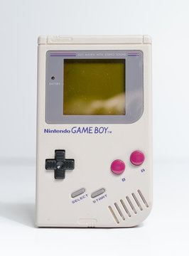 london, england, 05/05/2019 A retro hand held nintendo gameboy game boy original, front on angle, isolated on a white studio background. Nintendo vintage famous iconic portable video game device.