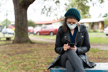 woman with mask in the park