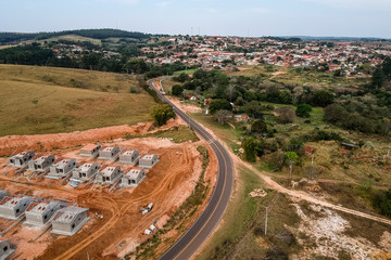 Fototapeta na wymiar Construction of standardized popular houses on the outskirts of a city in the interior of the state of Sao Paulo, Brazil