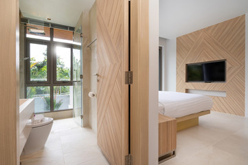 Interior design in villa, house, home, condo and apartment feature bedroom and bathroom with a view