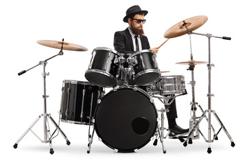 Elegant male musician playing drums