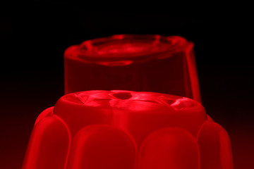 Red gelatine on a black background