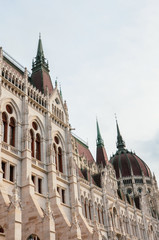 Building of the Hungarian Parliament Orszaghaz in Budapest, Hungary. The seat of the National Assembly. House built in neo-gothic style. Sunset light shining on the building. Hungarian concept