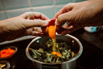 .Middle-aged woman preparing a healthy pizza based on fresh food. Cooking at home relaxed and unhurried. Stay home