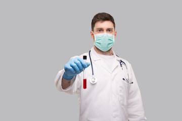 Male Doctor Showing Blood Analysis Wearing Medical Mask and Gloves. Laboratory Virus Concept
