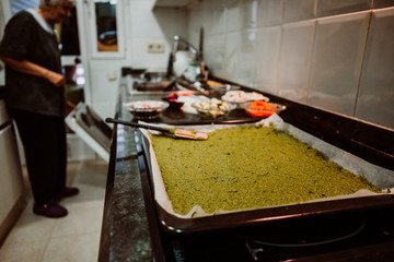 .Middle-aged woman preparing a healthy pizza based on fresh food. Cooking at home relaxed and unhurried. Stay home