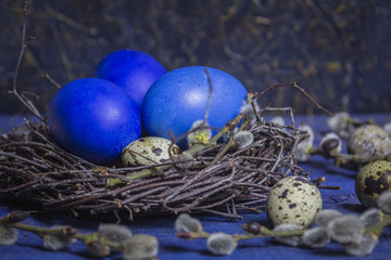 Blue Easter eggs on vibrant wooden table background