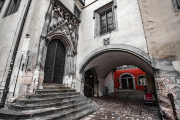 Black and white shot with red elements of Regensburg old town hall of Regensburg