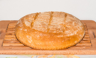 Freshly baked home made bread on board.