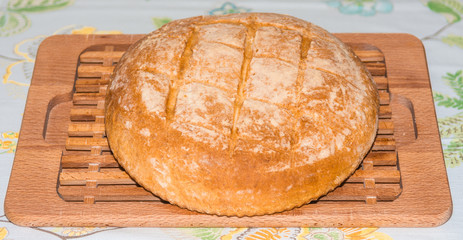 Freshly baked home made bread on board.