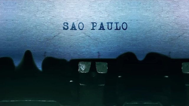 SAO PAULO Word closeup Being Typing and Centered on a Sheet of paper on old vintage Typewriter mechanical 4k Footage Background Animation.