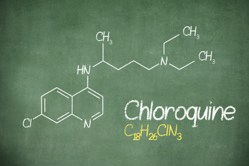 Chloroquini phosphas, chloroquine medicine substance. Drug introduced as treatment for coronavirus (SARS-CoV-2). Active in COVID-19 supportive therapy. Chemical formula written with chalk on board.