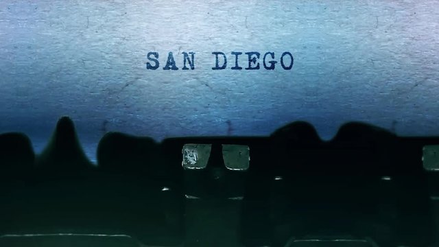 SAN DIEGO Word closeup Being Typing and Centered on a Sheet of paper on old vintage Typewriter mechanical 4k Footage Background Animation.