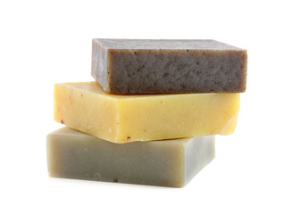 Different bars of organic handmade soap isolated on white