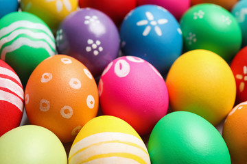 Fototapeta na wymiar Colorful Easter eggs with different patterns as background, closeup