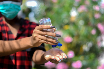 Using a hand sanitizer to prevent coronavirus infection