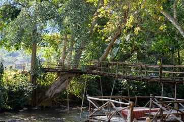 Fototapeta na wymiar Beautiful view of a bamboo bridge in the countryside of Laos