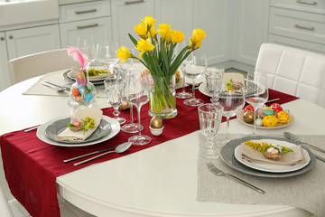 Festive Easter table setting with floral decor in kitchen