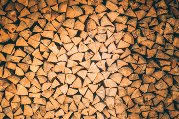 surface of tightly laid wooden logs in the wall