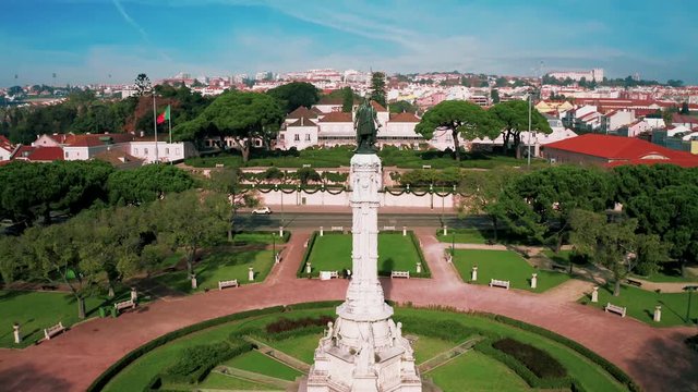 Flying towards Belem Palace over monument in 4k.