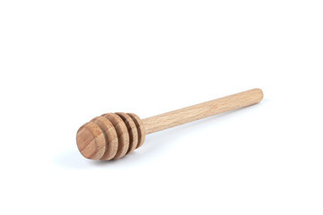 Wooden spoon for honey on a white background