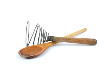 Wooden spoon and steel retro whisk