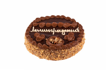 Cake with chocolate cream and nuts on a white background