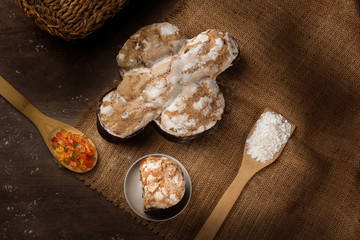 Easter dove bread (colomba Pasquale) made with candied fruits and wheat on a rustic wooden table, top view