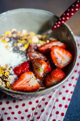 Healthy breakfast concept with oatmeal and strawberry