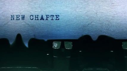 New Chapter Word closeup Being Typing and Centered on a Sheet of paper on old vintage Typewriter mechanical 4k Footage Background Animation.