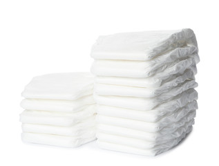 Stacks of baby diapers isolated on white