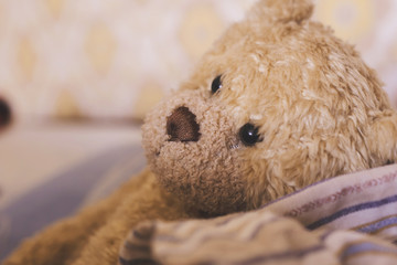 Stay home. Teddy bear with some warm pajamas. Begcound texture home comfort.