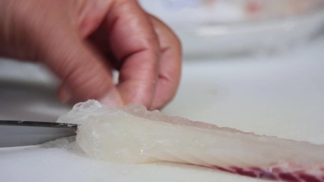Experienced Fisherman Slicing Fish in Fish Market to cook sashimi, Jeju-Island