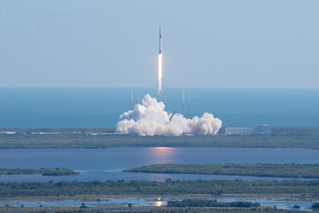 Rocket launch liftoff reflection on water