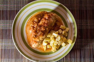chicken chops stuffed with ham and cheese tomato sauce and french fries