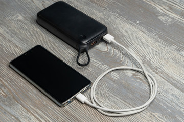 Phone charging with energy bank. Smartphone charging by usb cable