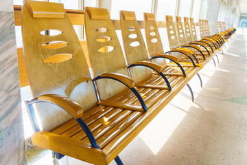 Empty wooden benches at the train station.