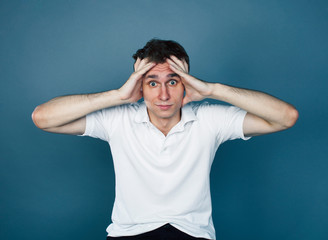 young goofy man with pimples pointing gesturing in studio, stupid bookwarm little crazy, lifestyle...