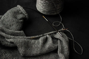 Fototapeta na wymiar Knitting on silver thread needles