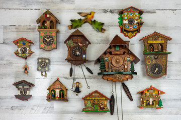 Vintage cuckoo clock collection on white background