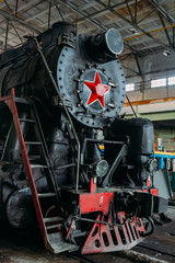 Old Soviet steam locomotive at the train depot