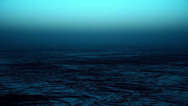 Flying into a foggy horizon over the deep blue ocean.