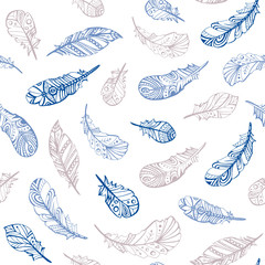 Repeating pattern of blue and beige feathers on a white background; background of different feathers; magic pattern of flying feathers; blank for creativity and scrubbing.