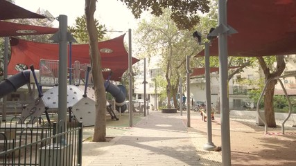 Closed and empty playground with red and white stripe line - do not cross