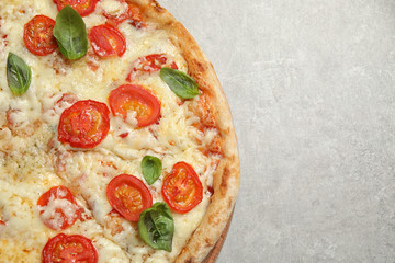 Delicious pizza Margherita on light grey table, top view. Space for text