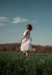 young woman running in the field